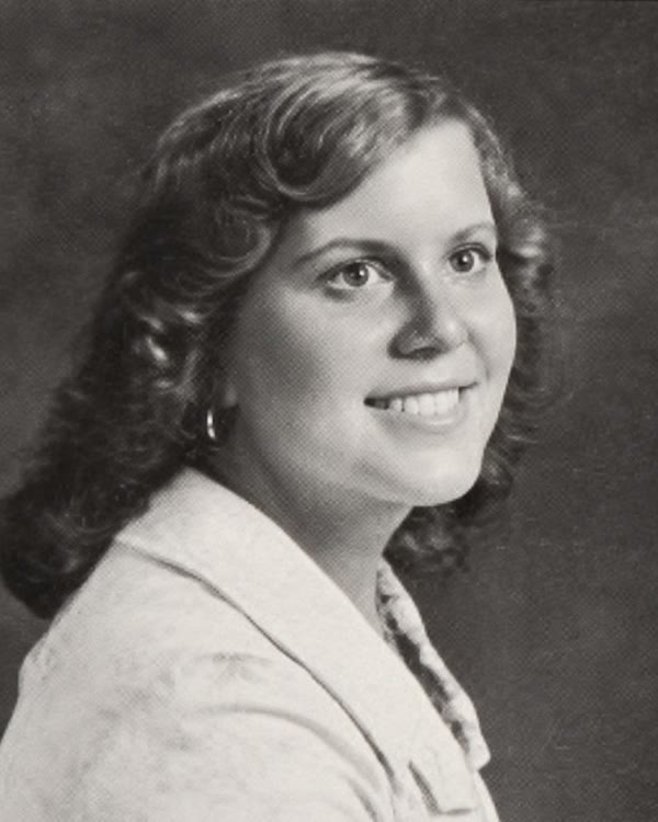 A classmate's black-and-white 1976 yearbook portrait.
